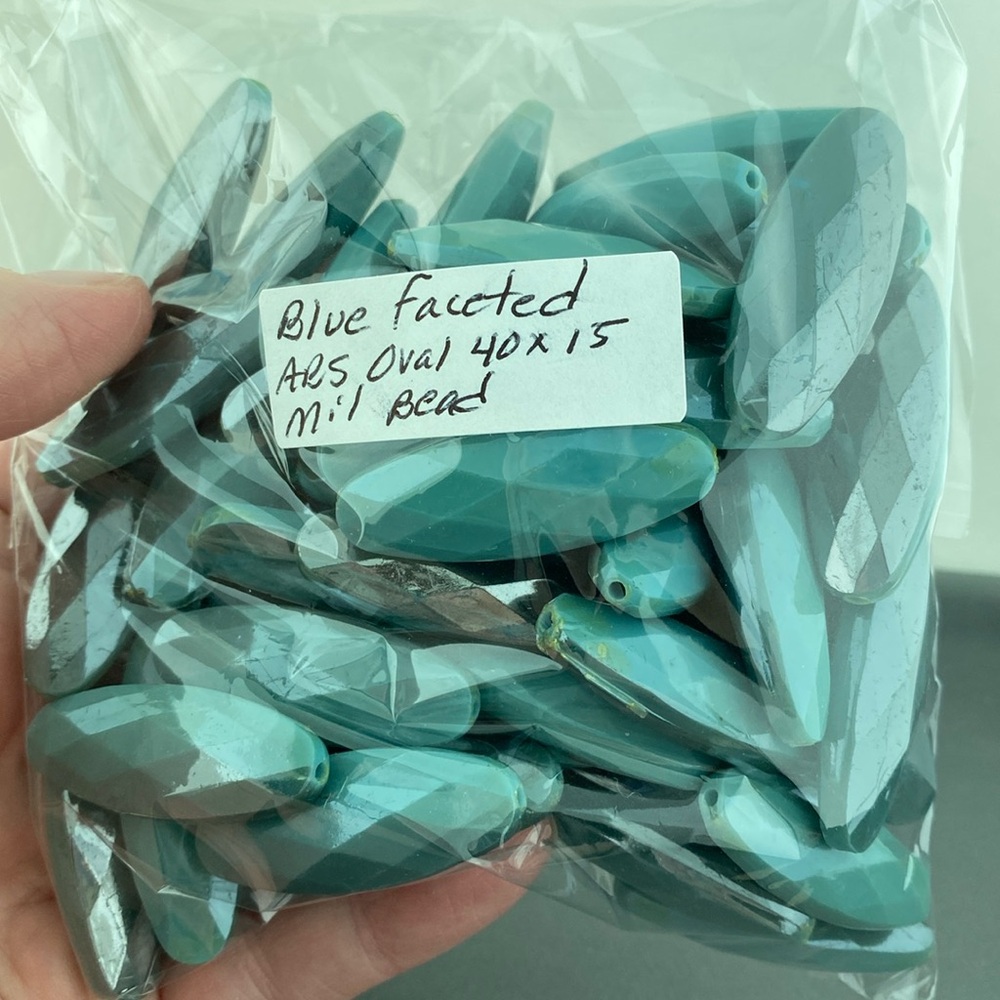 Bag of 50 40x15mm faceted ABS teal blue beads